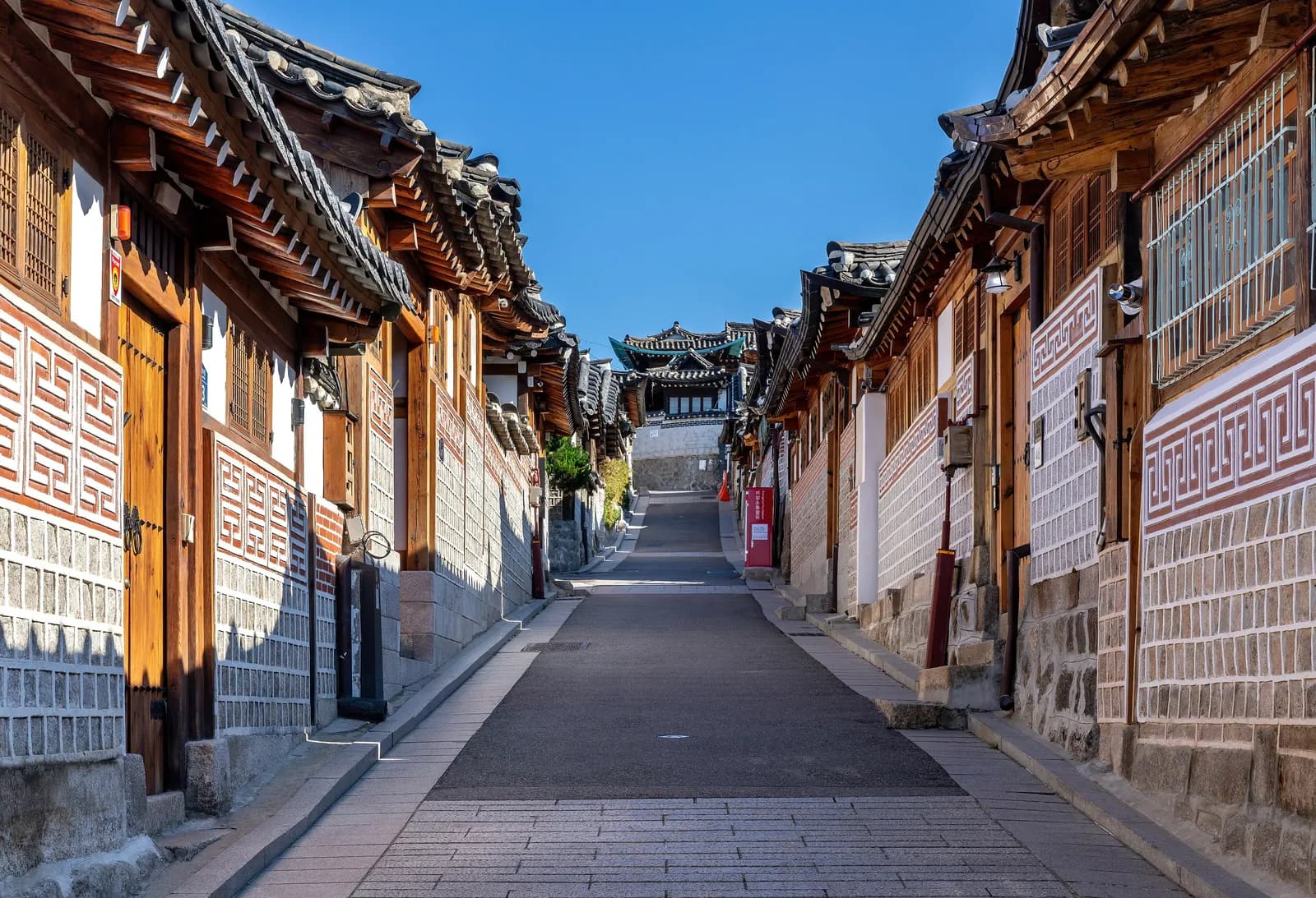 A lane of hanok houses in Bukchon Hanok Village, Seoul, 2024.